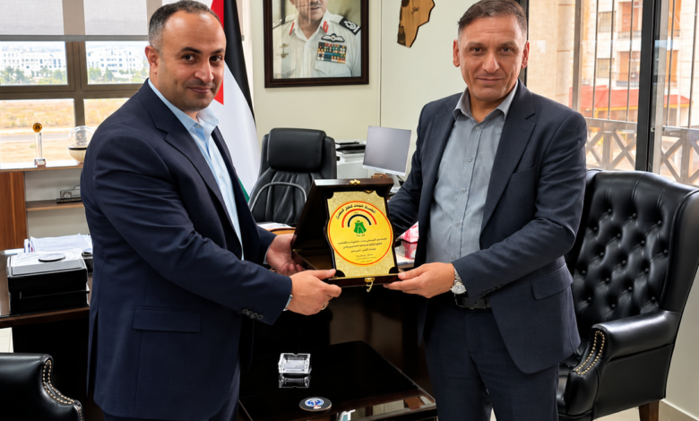 Jordan Maritime Commission Director General Ahmad Al-Assasleh meets Captain Mazen Talib Saddam to discuss maritime safety and ship inspections.