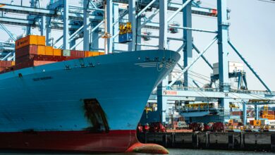 Maersk container shipping operations amid new peak season surcharges affecting international trade routes.